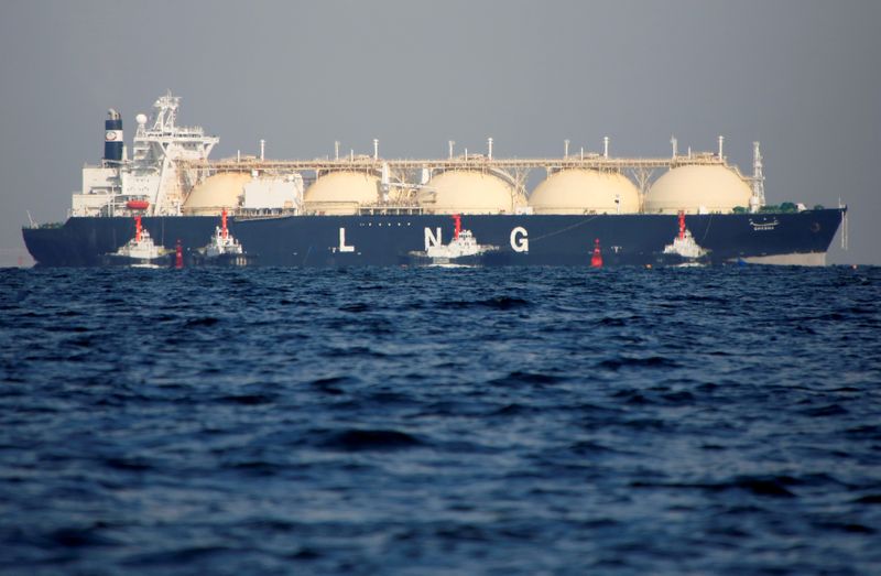 FILE PHOTO: A LNG tanker is tugged towards a thermal