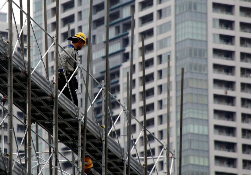 FILE PHOTO: A worker is seen at the construction site