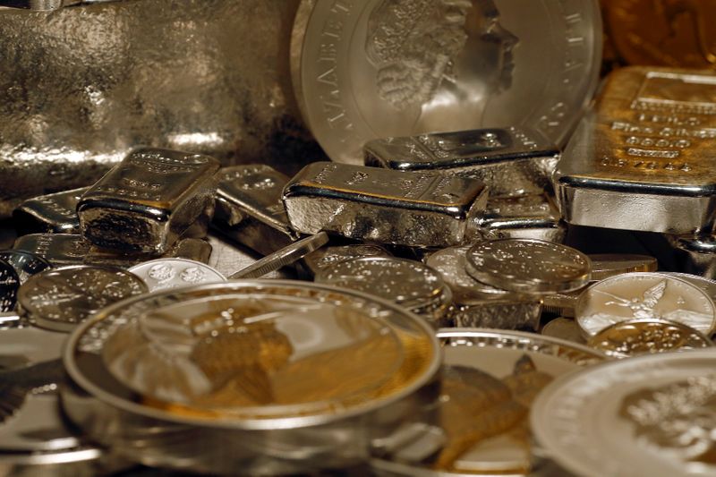 FILE PHOTO: Silver bars and coins are stacked in safe