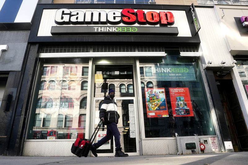 FILE PHOTO: A person walks past a GameStop in New