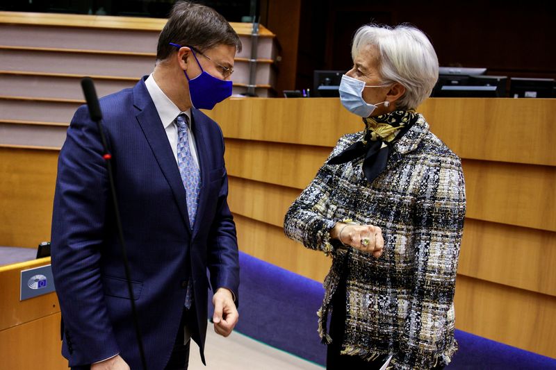 EC’s Dombrovskis (L) greets ECB’s Lagarde in Brussels