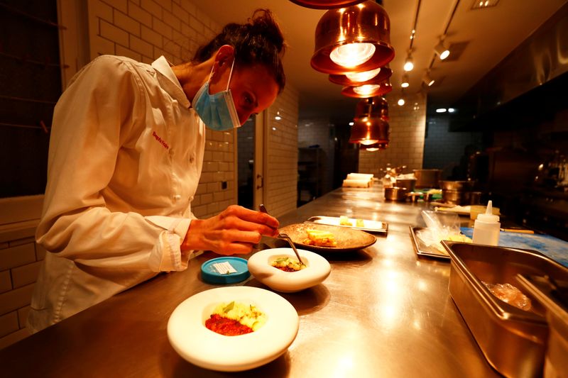 Fraire, chef and owner of restaurant “Etimo”, prepares a dish