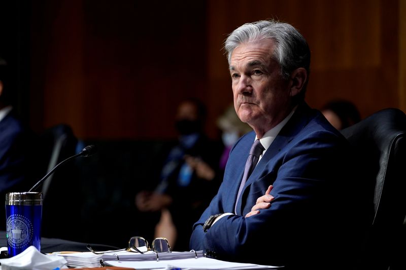 FILE PHOTO: Chairman of the Federal Reserve Jerome Powell listens
