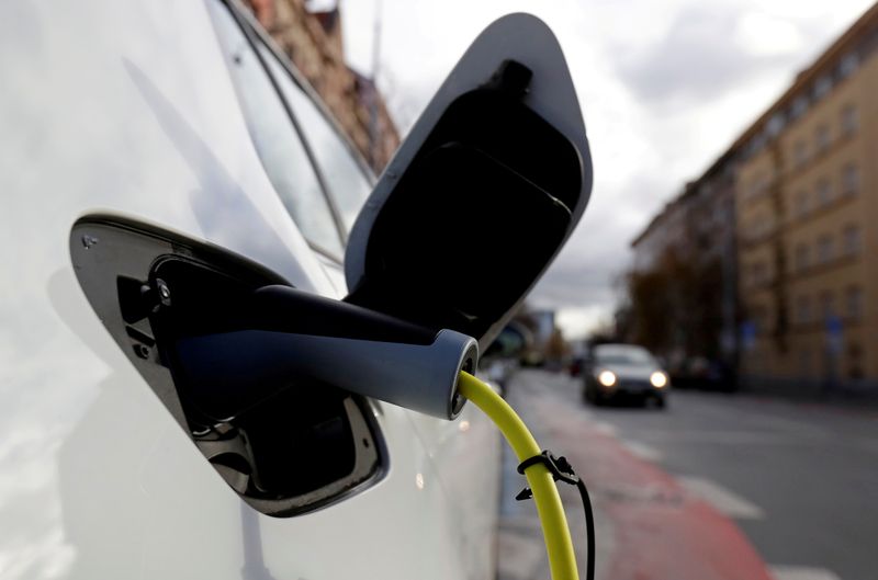 FILE PHOTO: FILE PHOTO: An electric car is charged by