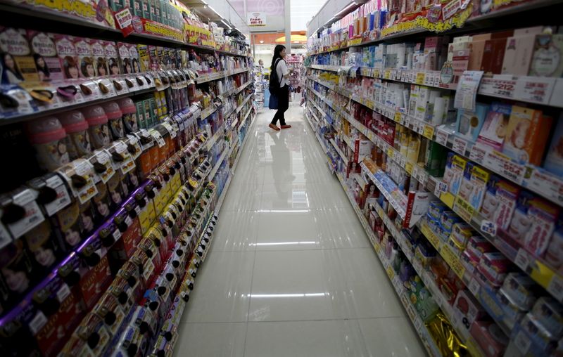 A shopper looks at items at a drug store in