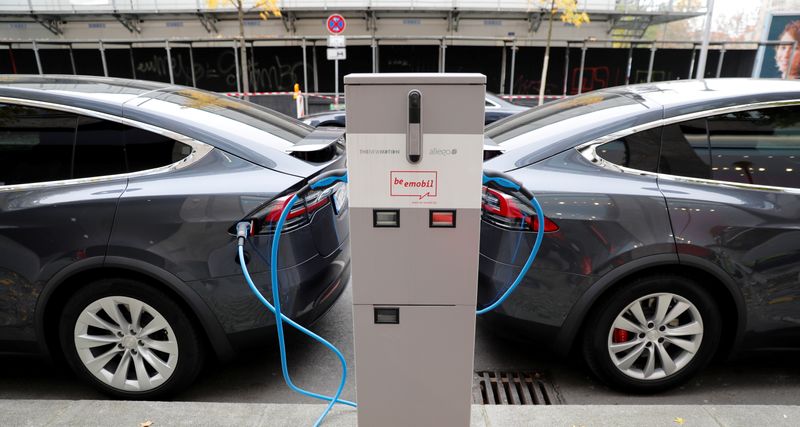 FILE PHOTO: Tesla Model X electric cars recharge their batteries