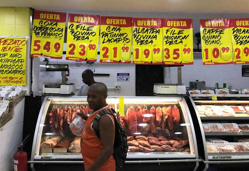 FILE PHOTO: A costumer buys meat at a supermarket in