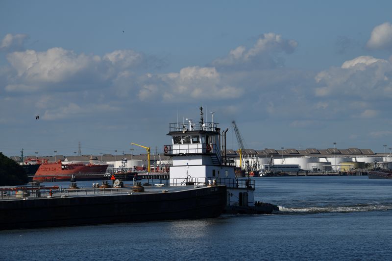 FILE PHOTO: A barge travels through the Houston Ship Channel,