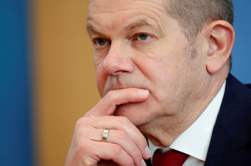 FILE PHOTO: German Finance Minister Olaf Scholz reacts during a