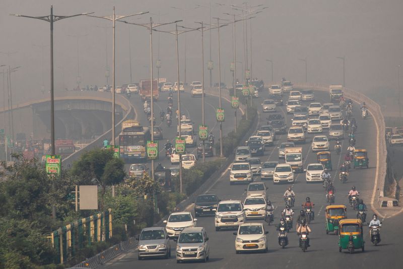 FILE PHOTO: Traffic moves on a smoggy morning in New