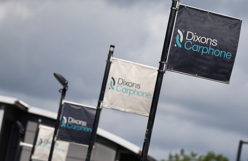 FILE PHOTO: Signs display the logo of Dixons Carphone at