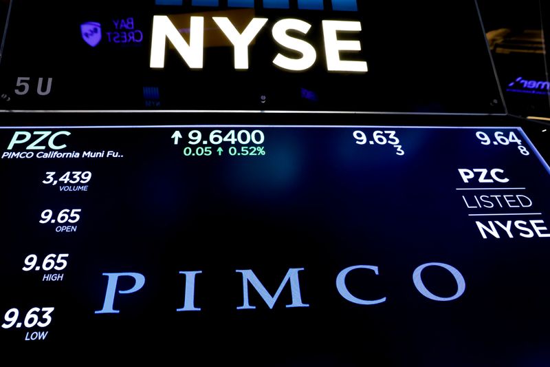 FILE PHOTO: Ticker and trading information for PIMCO are displayed