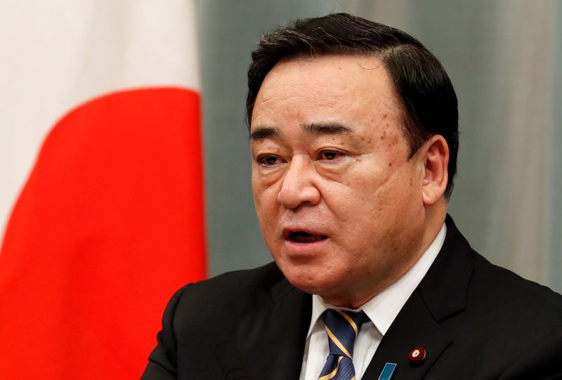 Japan’s Economy, Trade and Industry Minister Hiroshi Kajiyama attends a