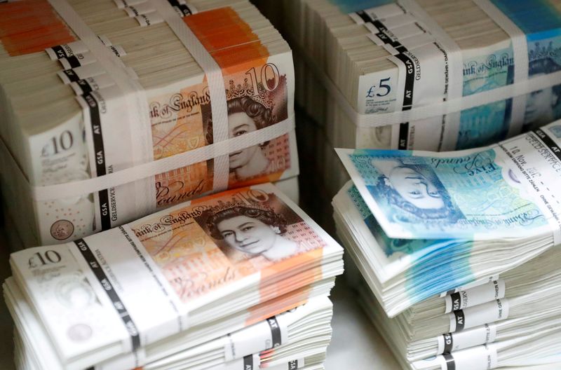 FILE PHOTO: Wads of British Pound Sterling banknotes are stacked