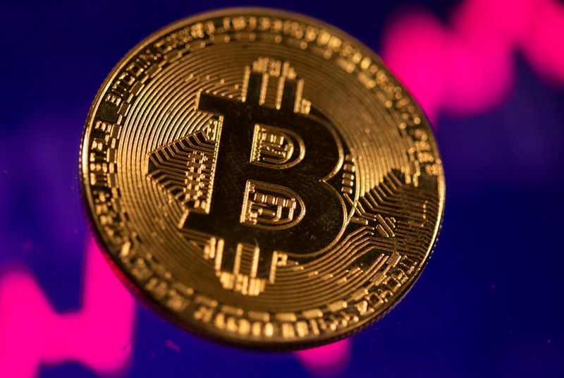 A representation of virtual currency Bitcoin is seen in front