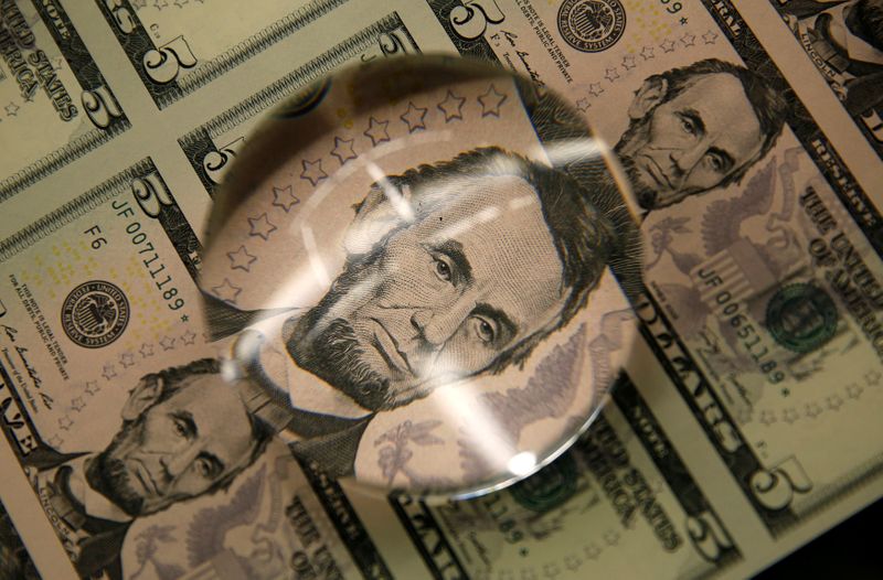 FILE PHOTO: FILE PHOTO: Sheets of Lincoln five dollar bill