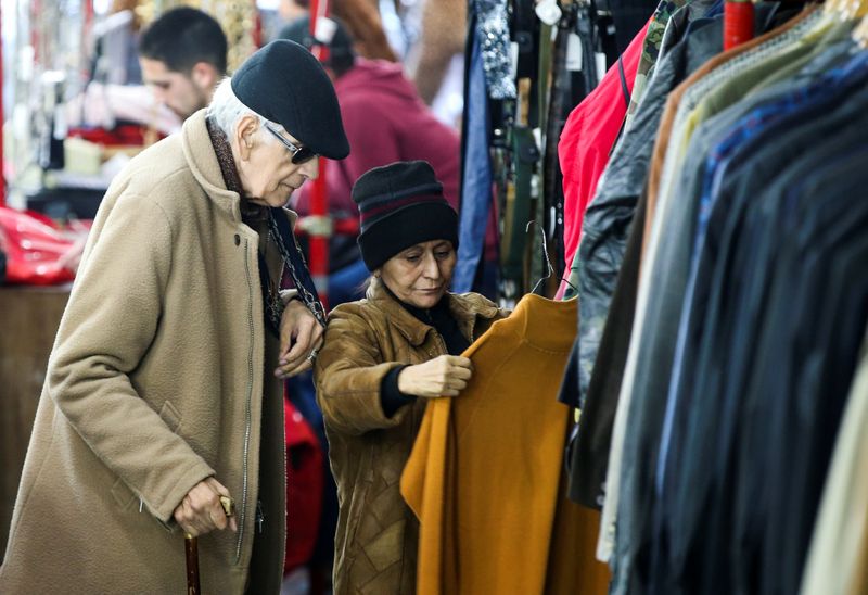 People shop in a used clothing shop in Buenos Aires