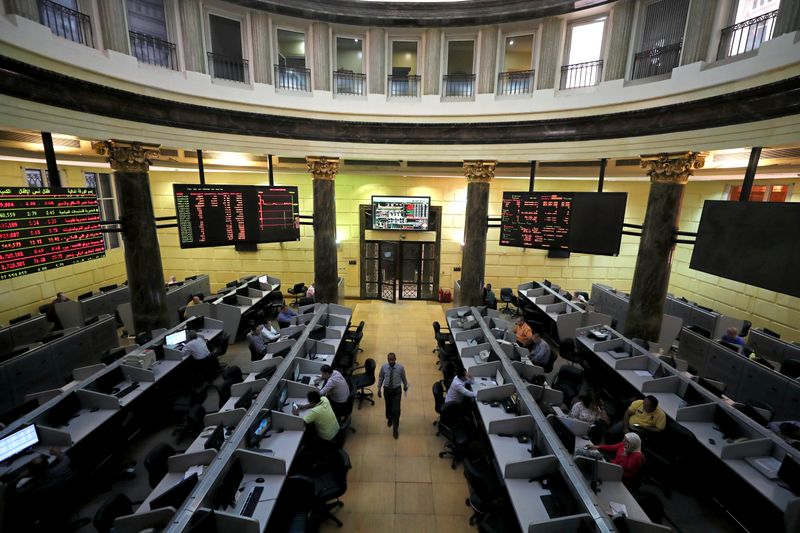 Traders work at the Egyptian stock exchange in Cairo