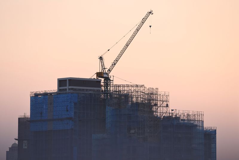 A construction site in seen during sunset in Taipei