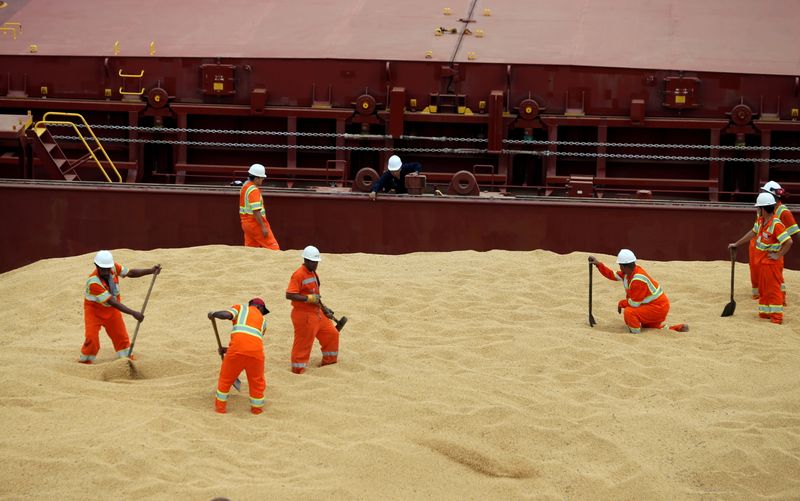 FILE PHOTO: Employees working at cargo ship Kypros Land which