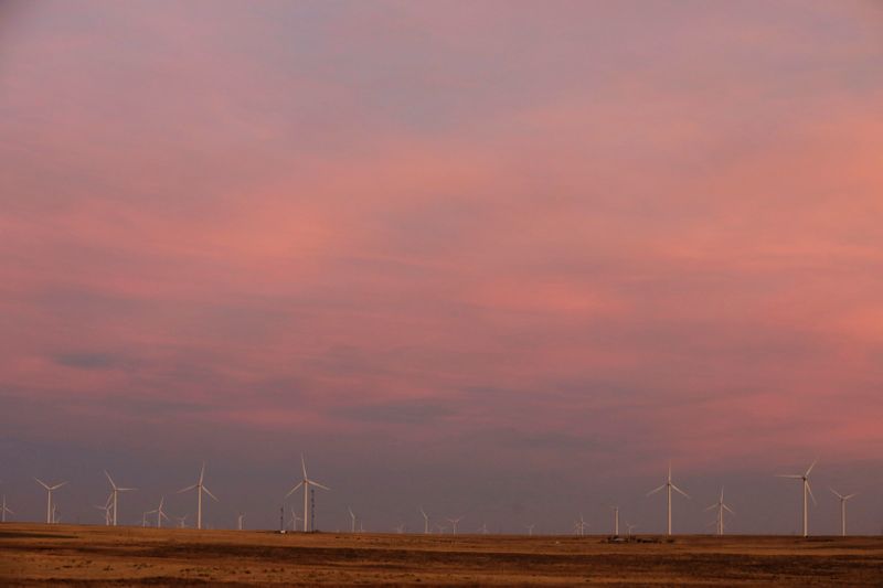 Wind turbines stand above the plains north of Amarillo, Texas