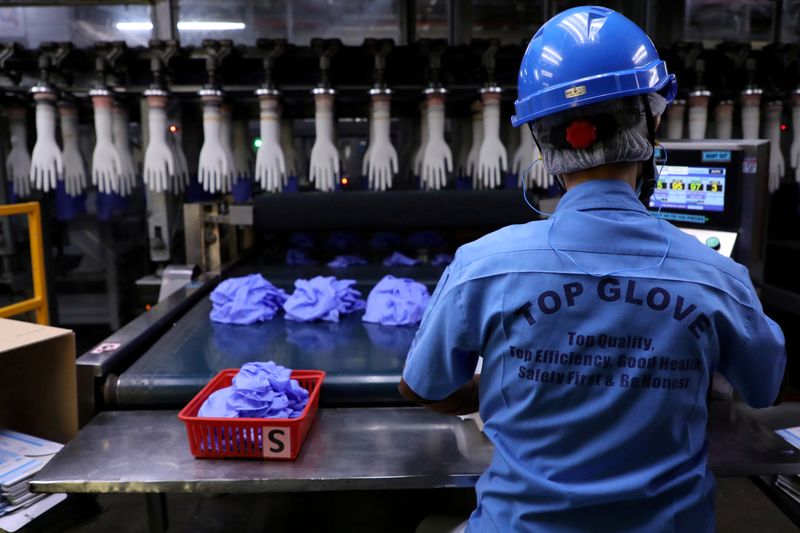 FILE PHOTO: A worker works at a production line in