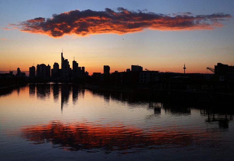 The skyline with its financial district is photographed during sunset