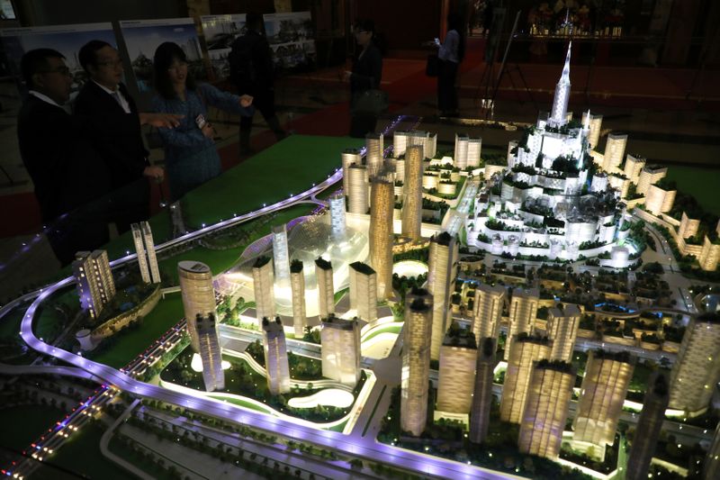 Visitors look at the model of Bandar Malaysia before the
