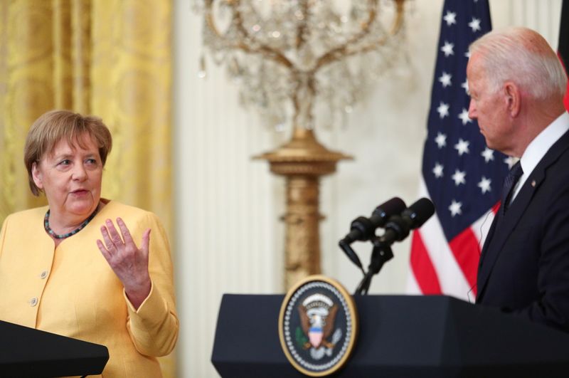 U.S. President Joe Biden and German Chancellor Angela Merkel attend
