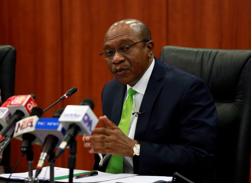 Nigeria’s Central Bank Governor Godwin Emefiele briefs the media during