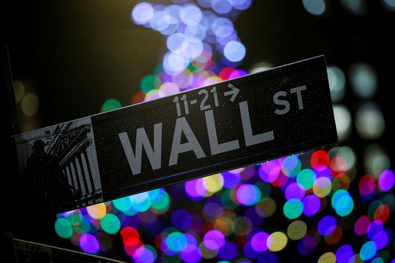 The Wall St. sign is seen outside the NYSE in