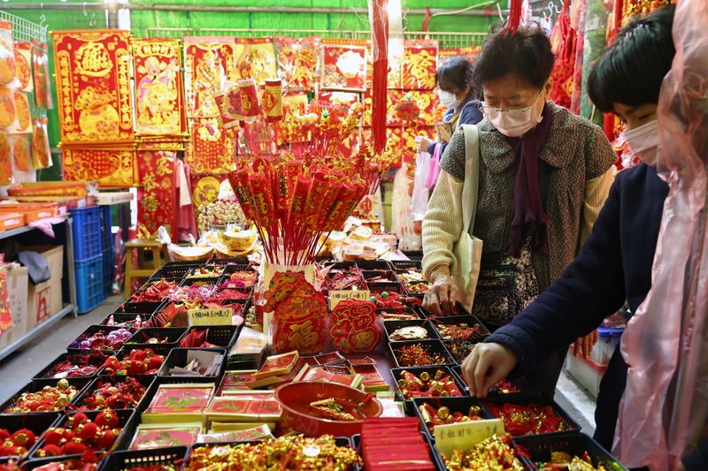 People buy New Year decorations ahead of the Lunar New