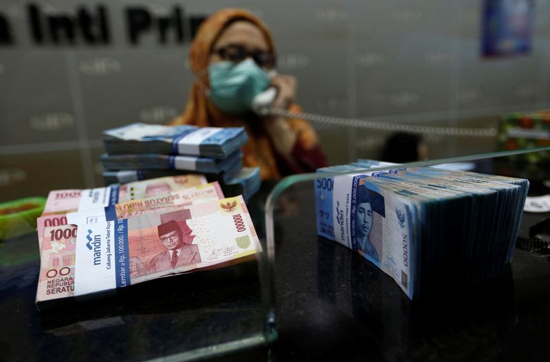 Indonesian rupiah banknotes are seen at a money changers in
