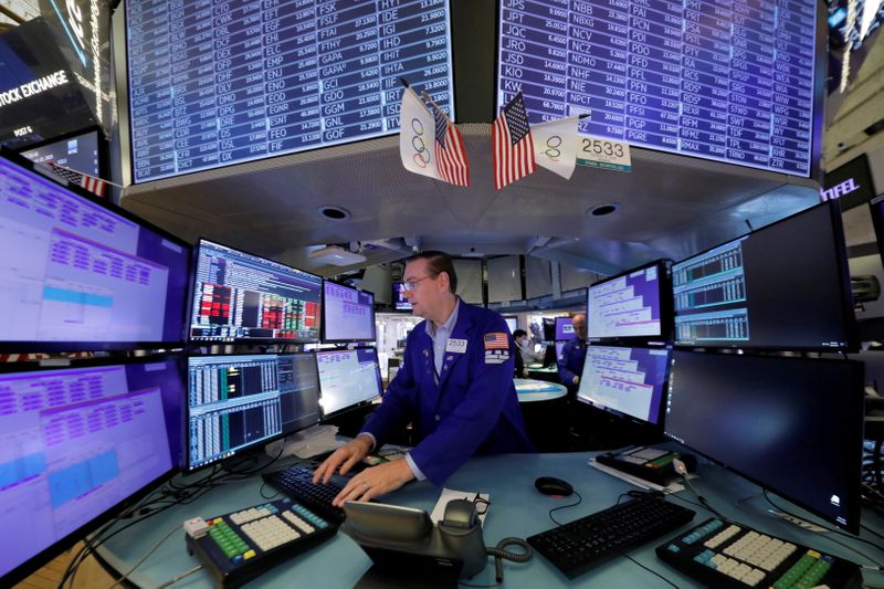 FILE PHOTO: A trader works at the New York Stock