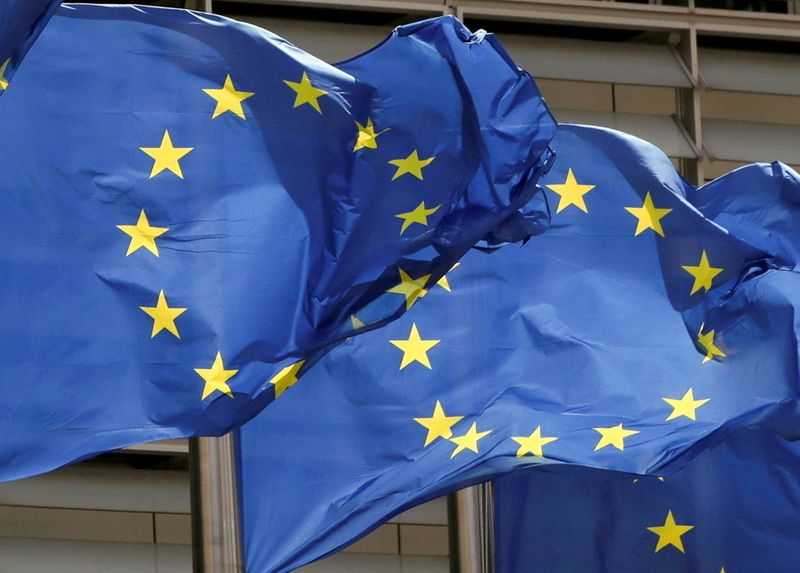 FILE PHOTO: European Union flags flutter outside the EU Commission