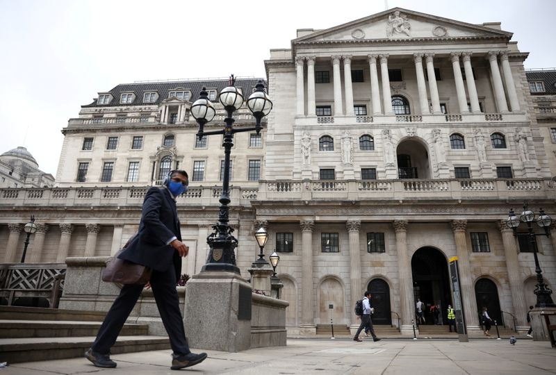 FILE PHOTO: A person walks past the Bank of England