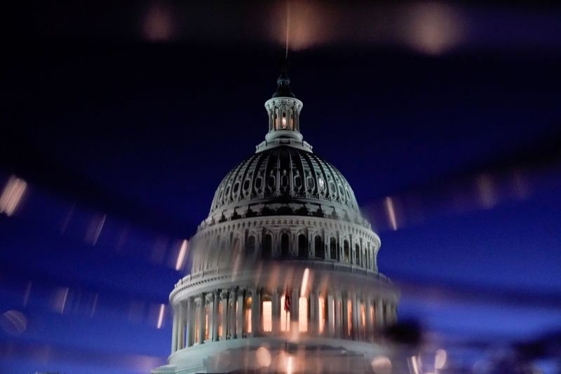 FILE PHOTO: The U.S. Capitol dome is seen reflected in
