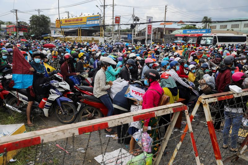 People planning to return to their hometowns wait at a