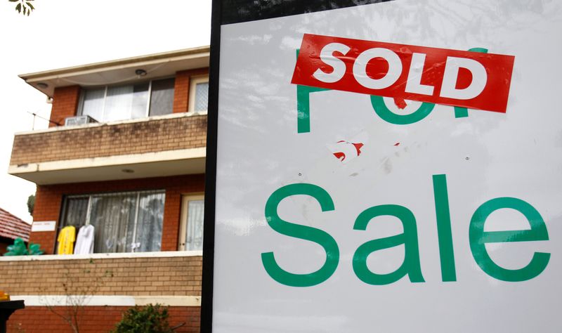 A ‘For Sale’ sign is seen in front of an