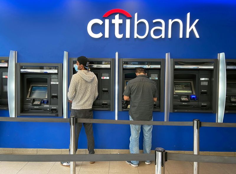 FILE PHOTO: Customers use ATMs at Citibank branch in New
