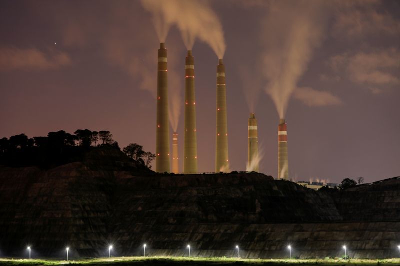 FILE PHOTO: Smoke and steam billows from the coal-fired power