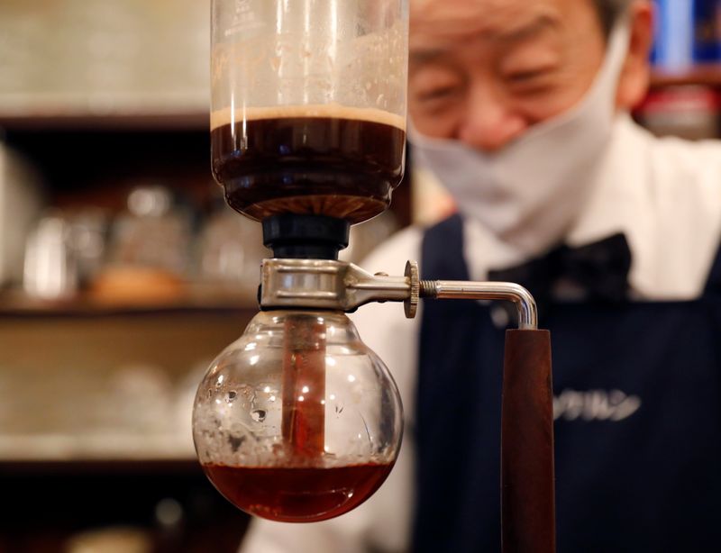 Shizuo Mori, the owner of Heckeln coffee shop brews coffee