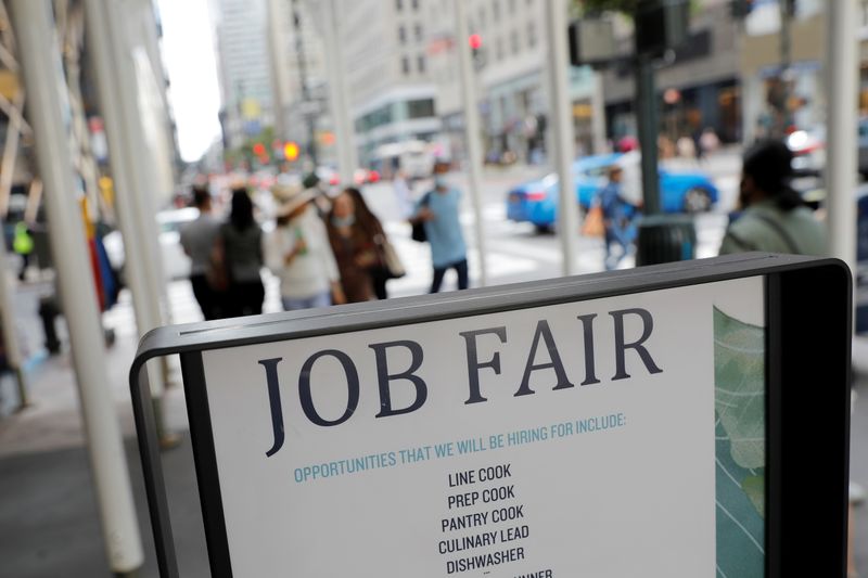 Signage for a job fair is seen on 5th Avenue