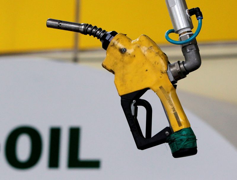 FILE PHOTO: FILE PHOTO: A gas pump is seen hanging