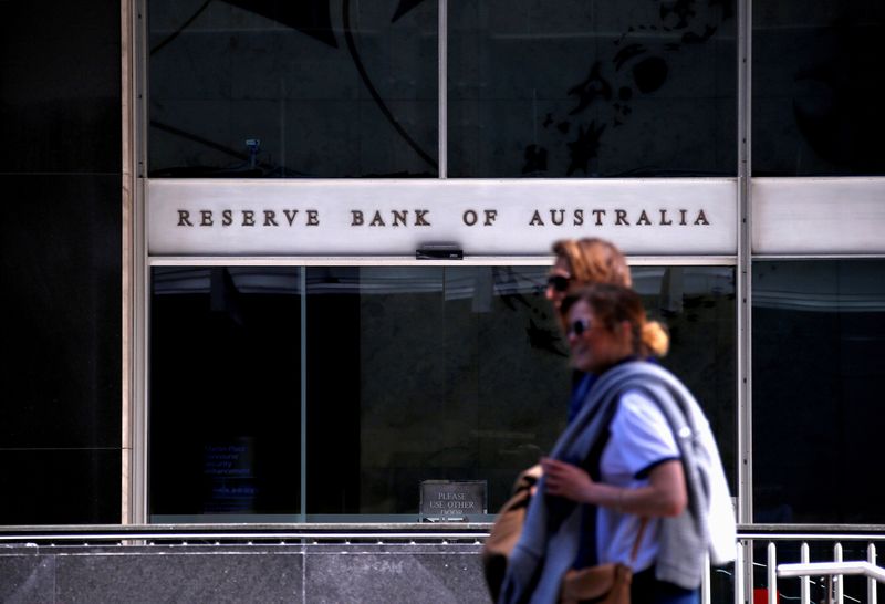 FILE PHOTO: Pedestrians walk past the main entrance to the
