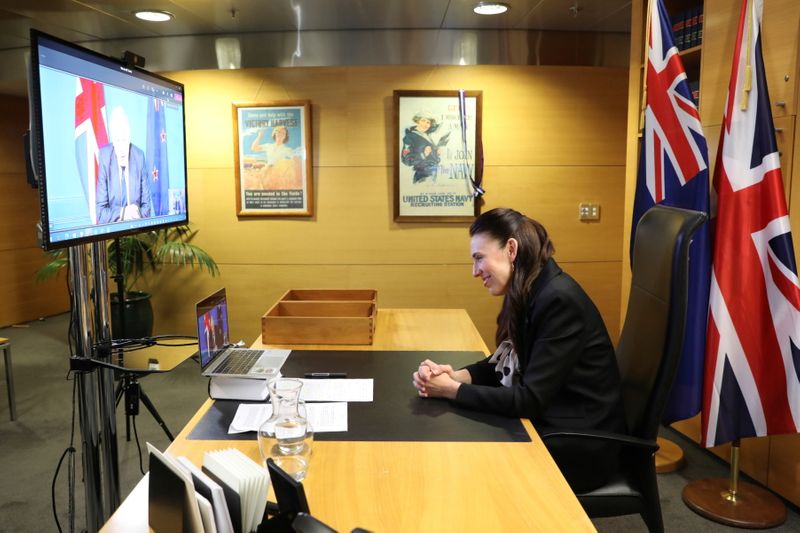 New Zealand’s Prime Minister Jacinda Ardern speaks with Britain’s Prime
