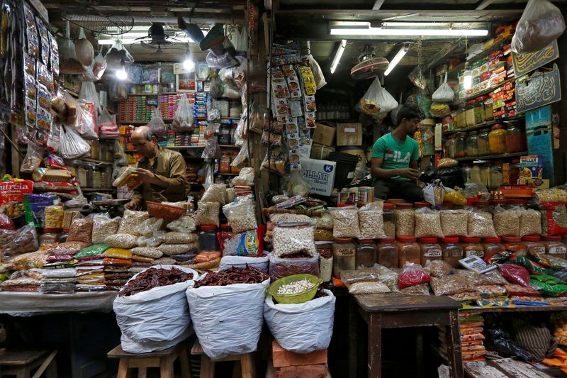FILE PHOTO: Vendors wait for customers at their respective shops