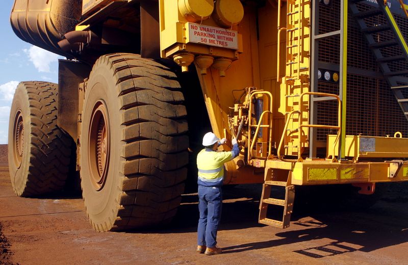 FILE PHOTO: FILE PHOTO: A worker checks a truck loaded