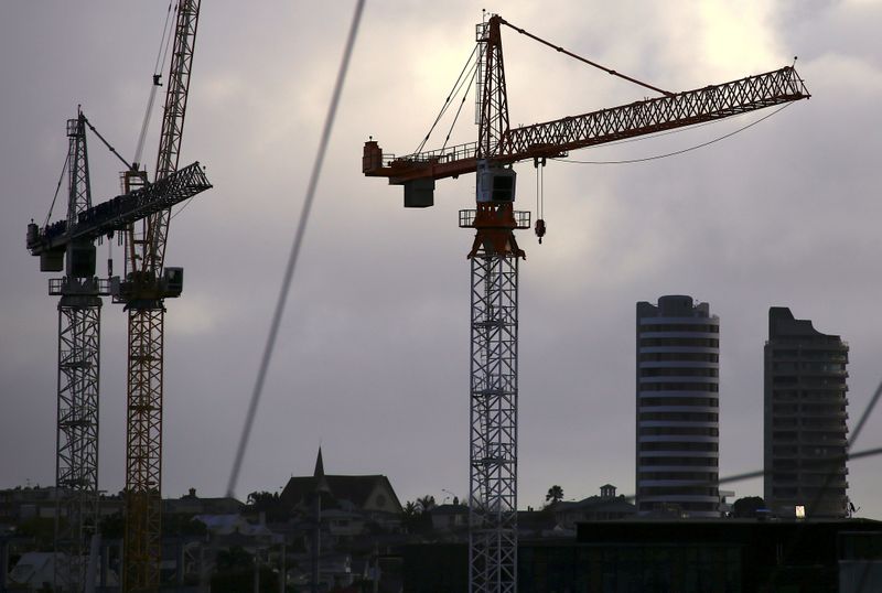 Cranes located on construction sites are seen near high-rise residential