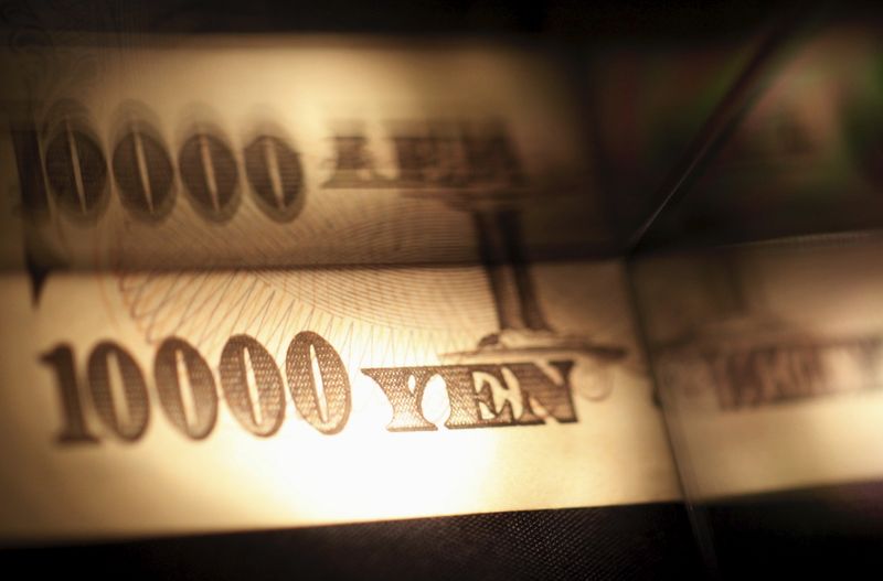 Light is cast on a Japanese 10,000 yen note as